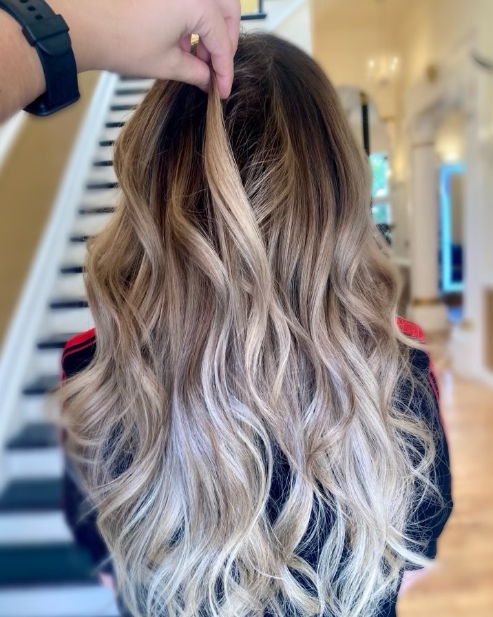 Balayage blonde hair extensions with seamless dark-to-light color melt at Fluff Hair Extensions Studio