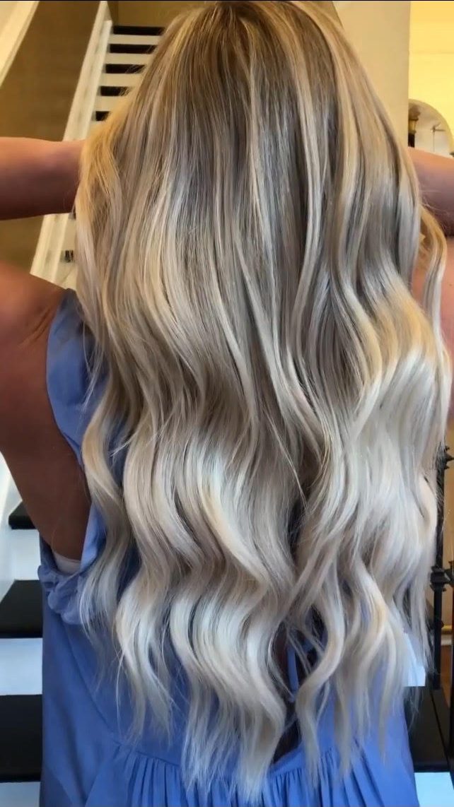Platinum blonde tape-in hair extensions with icy cool-toned waves at Fluff Hair Extensions Studio