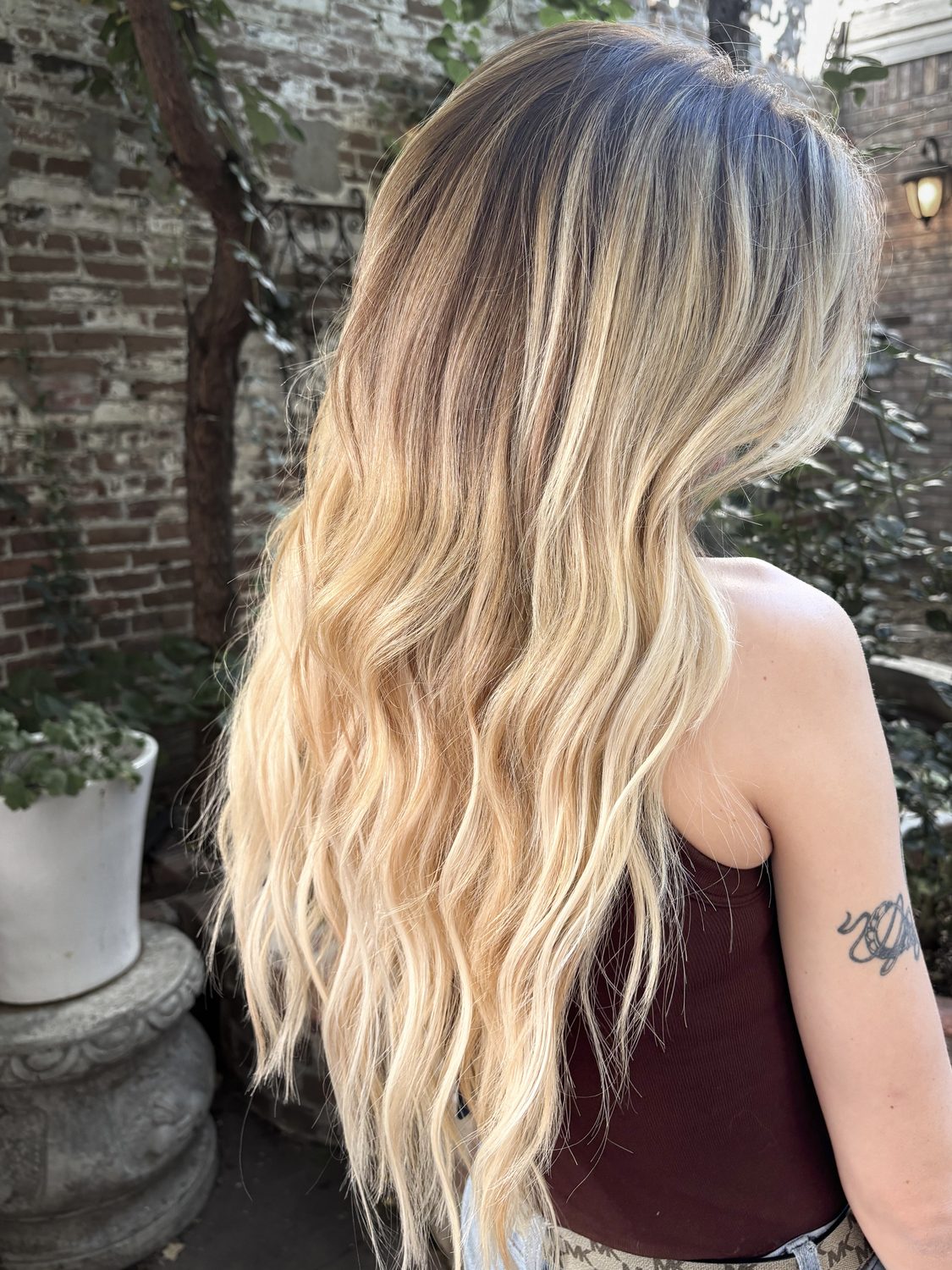 Finished blonde tape-in extension transformation from the Fluff gallery