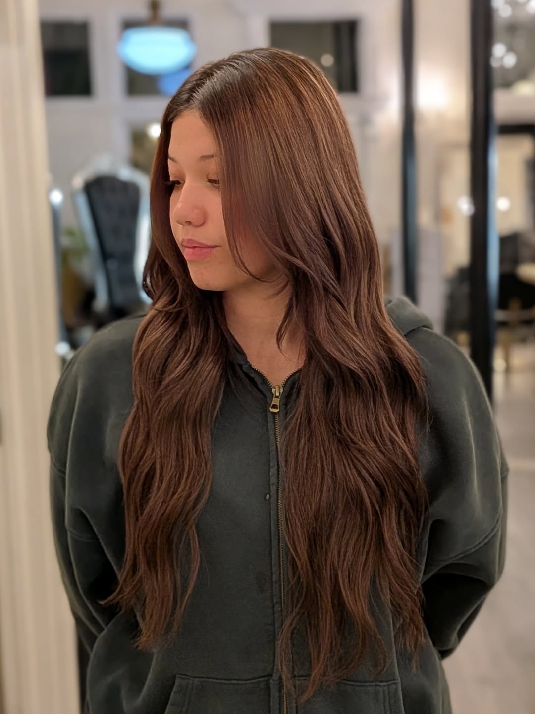 Natural brunette tape-in hair extensions with seamless finish by Haley at Fluff Hair Extensions Studio